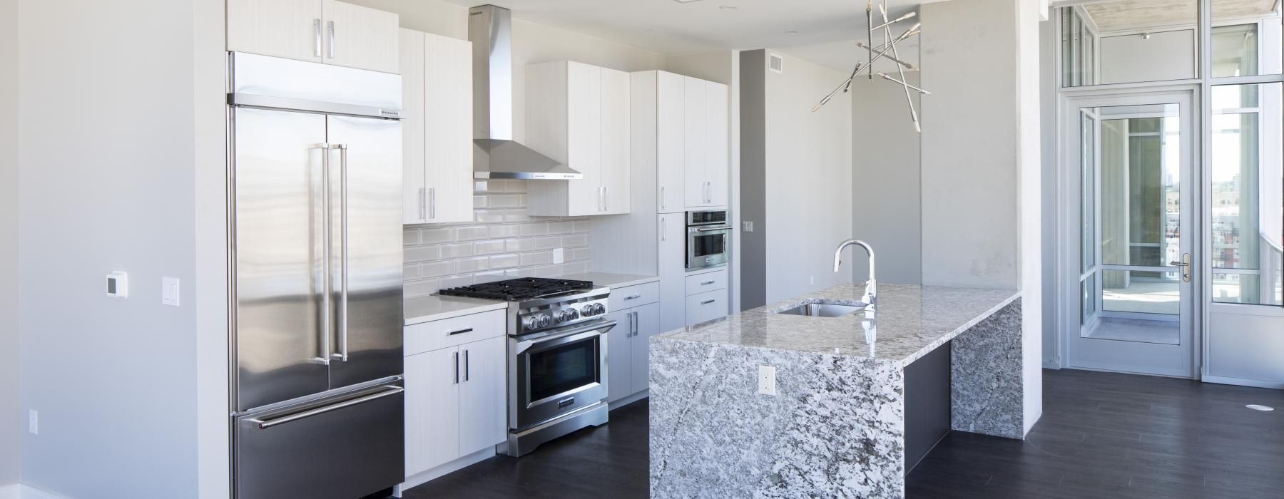 a kitchen with white cabinets