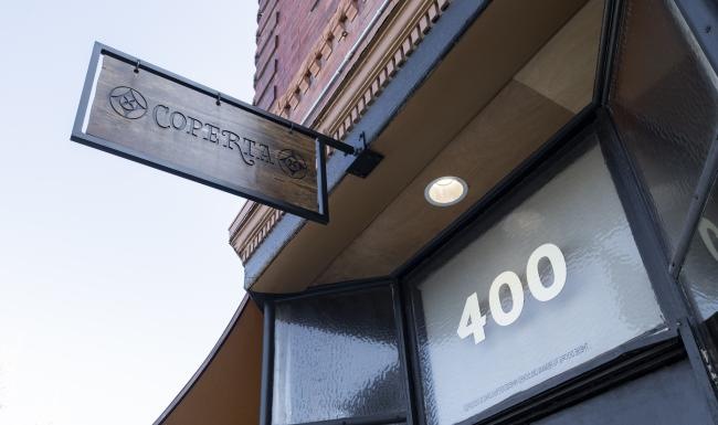 a street sign on the side of a building