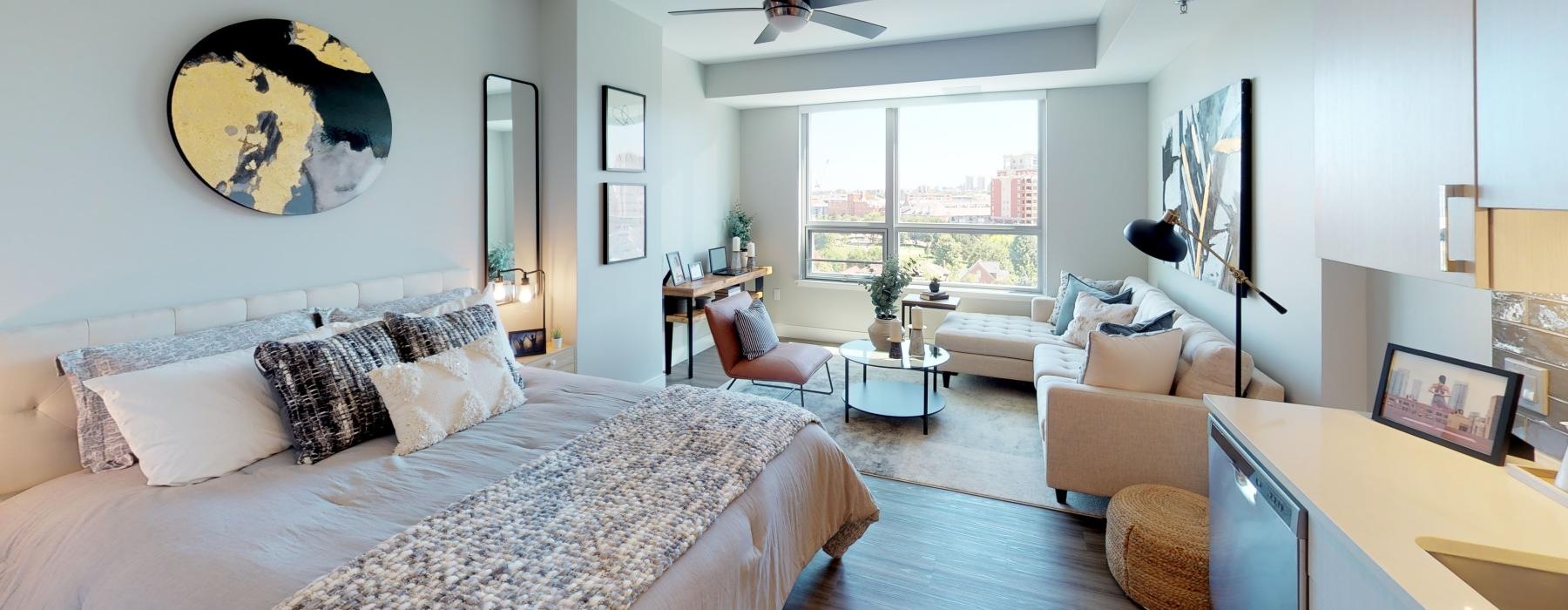 a bedroom with a large window