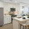 a kitchen with white cabinets